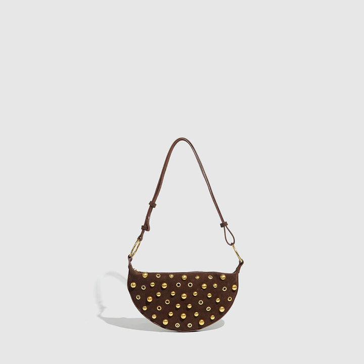 Brown studded shoulder bag with gold hardware and adjustable strap