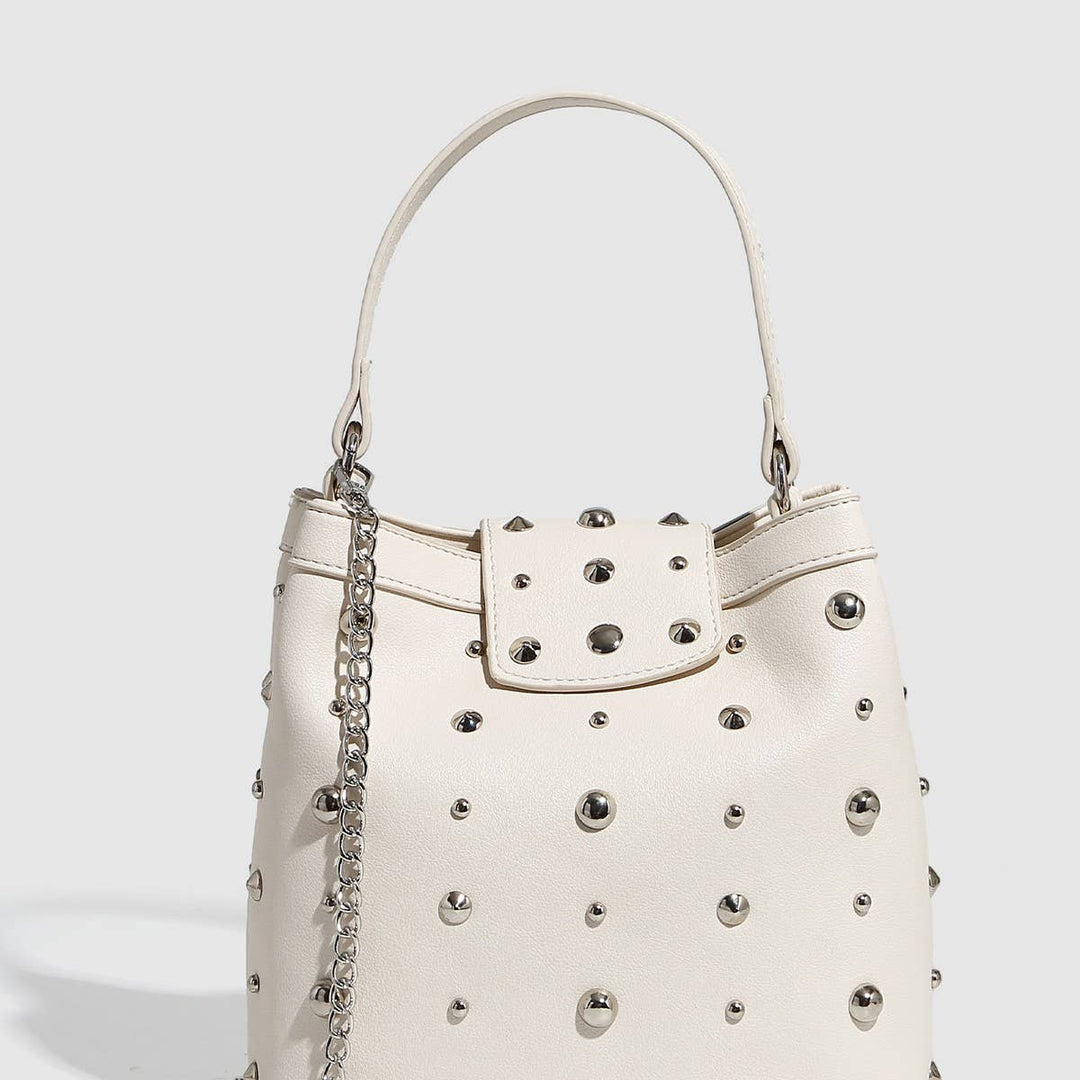 White studded mini shoulder bag with silver hardware and chain strap, shown with and without phone for size reference
