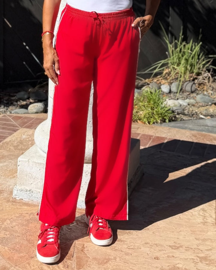 model wearing red Sideline Track Pant, close-up on waistband and drawstring detail
