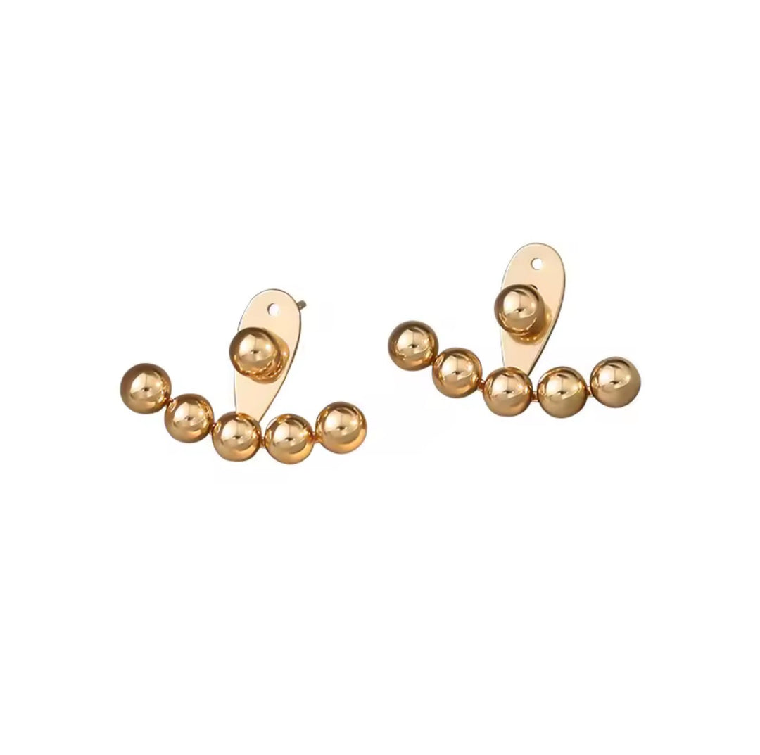 Gold beaded earrings on a white background