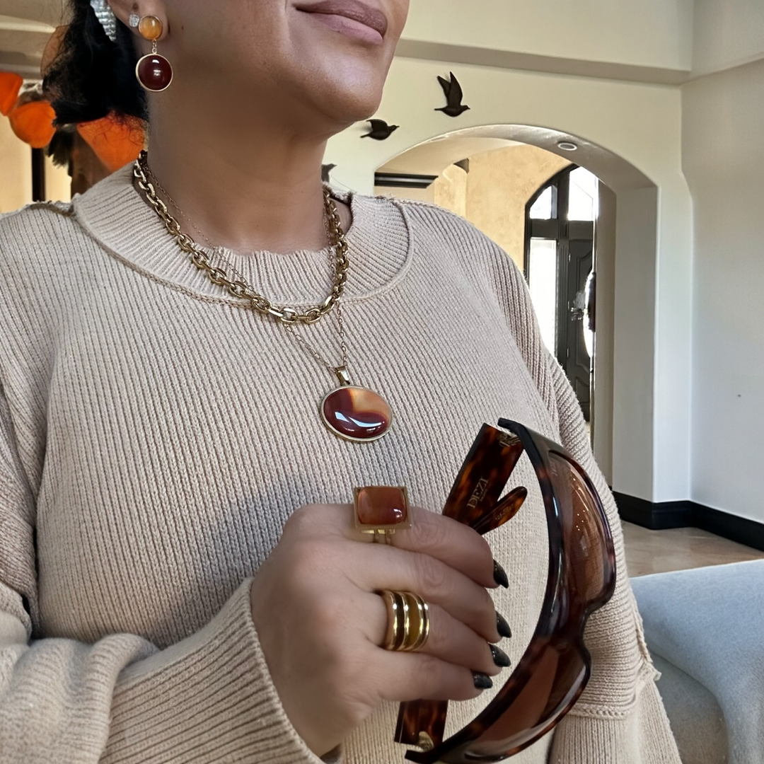 women wearing a square carnelian ring set in 18k gold plated stainless steel