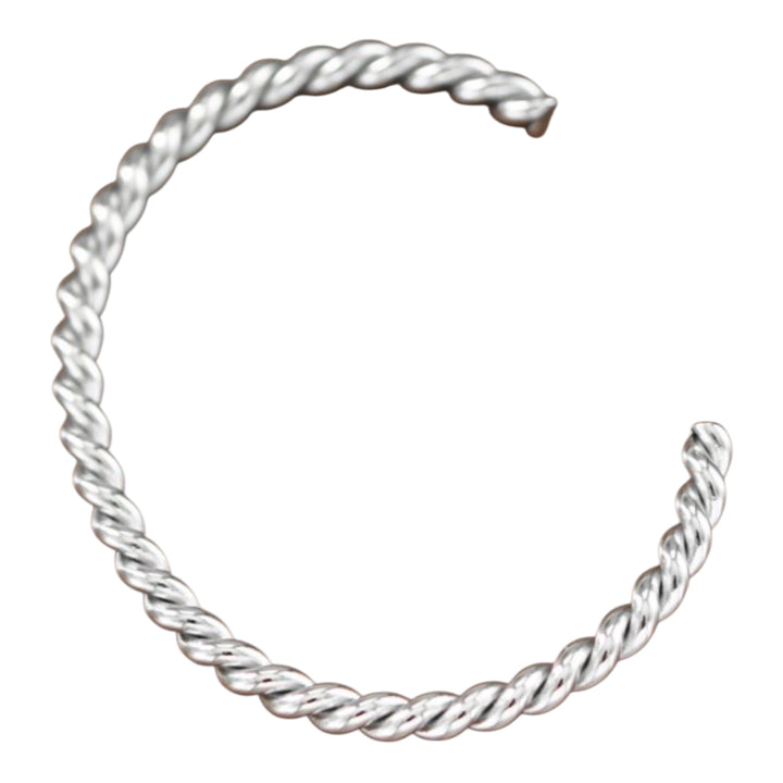 Silver twisted bangle on a white background