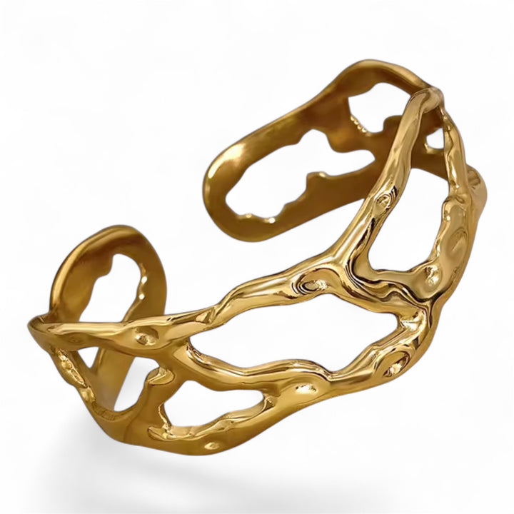 Gold bracelet with a natural, organic design on a white background