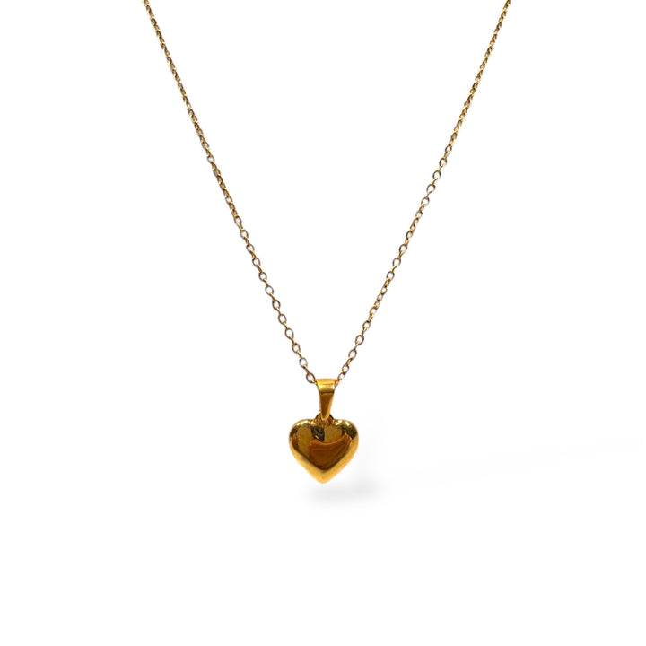 Gold heart-shaped pendant necklace on a white background