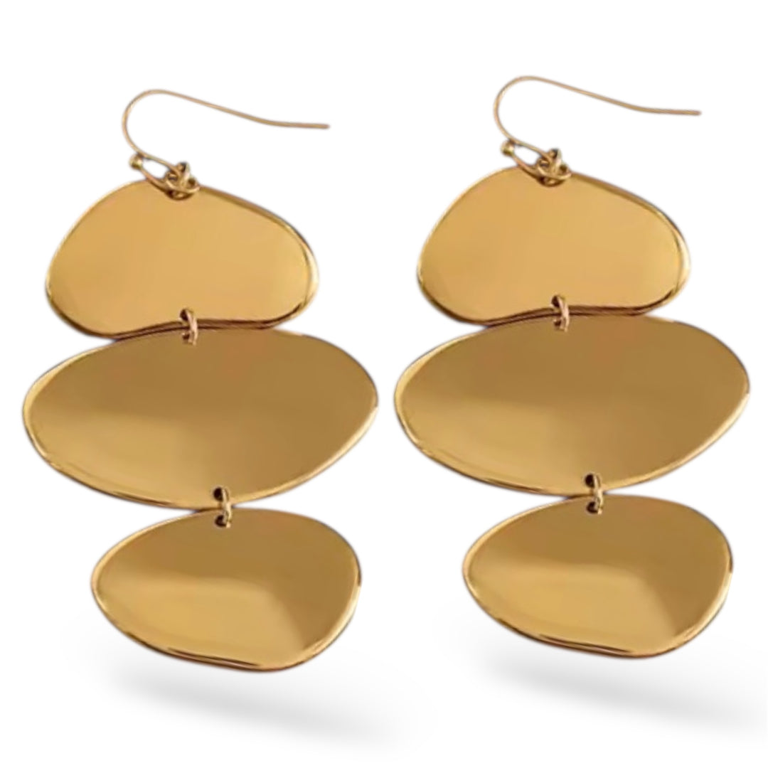 Gold layered earrings on a white background