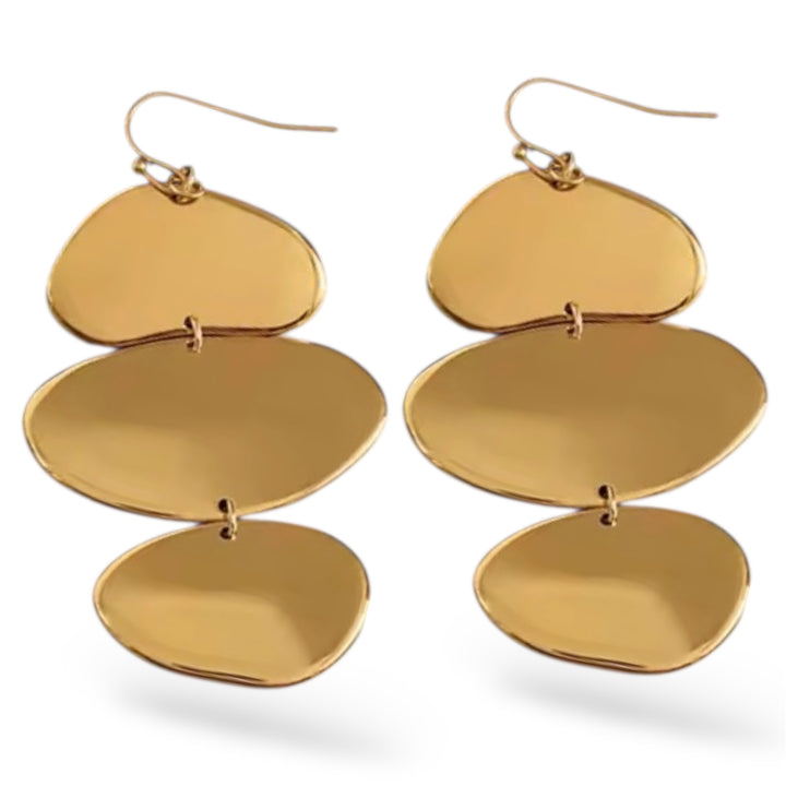 Gold layered earrings on a white background