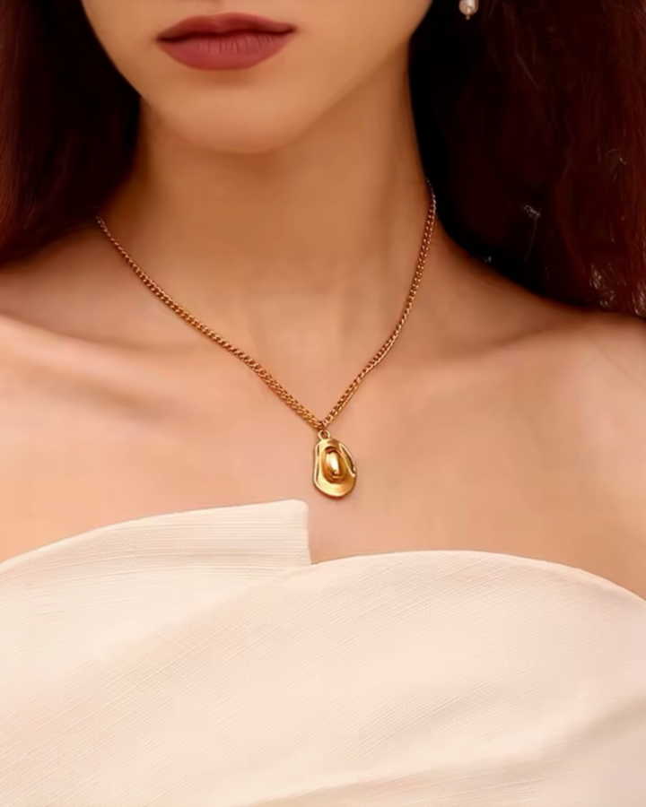 Gold cowboy hat pendant necklace on chain, western cowgirl style waterproof stainless steel jewelry.