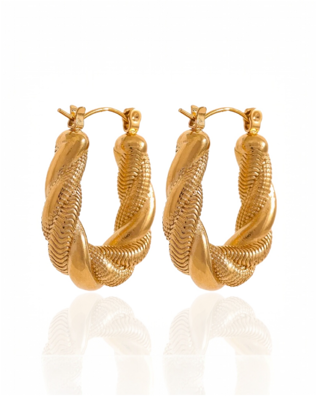 Gold hoop earrings on a white background