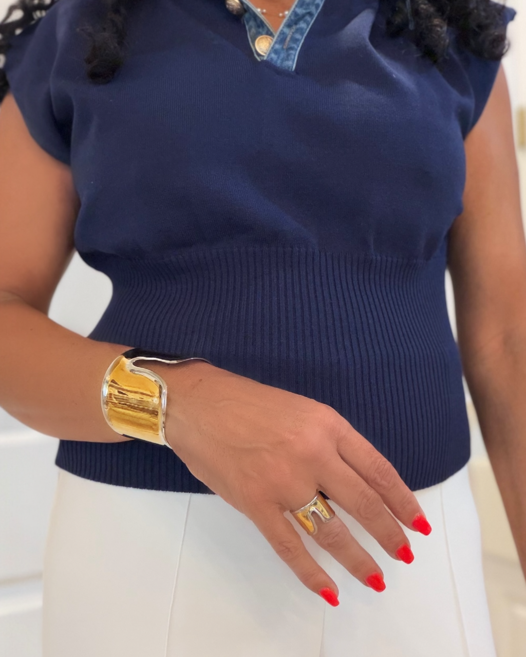 woman wearing a wide two-tone band ring