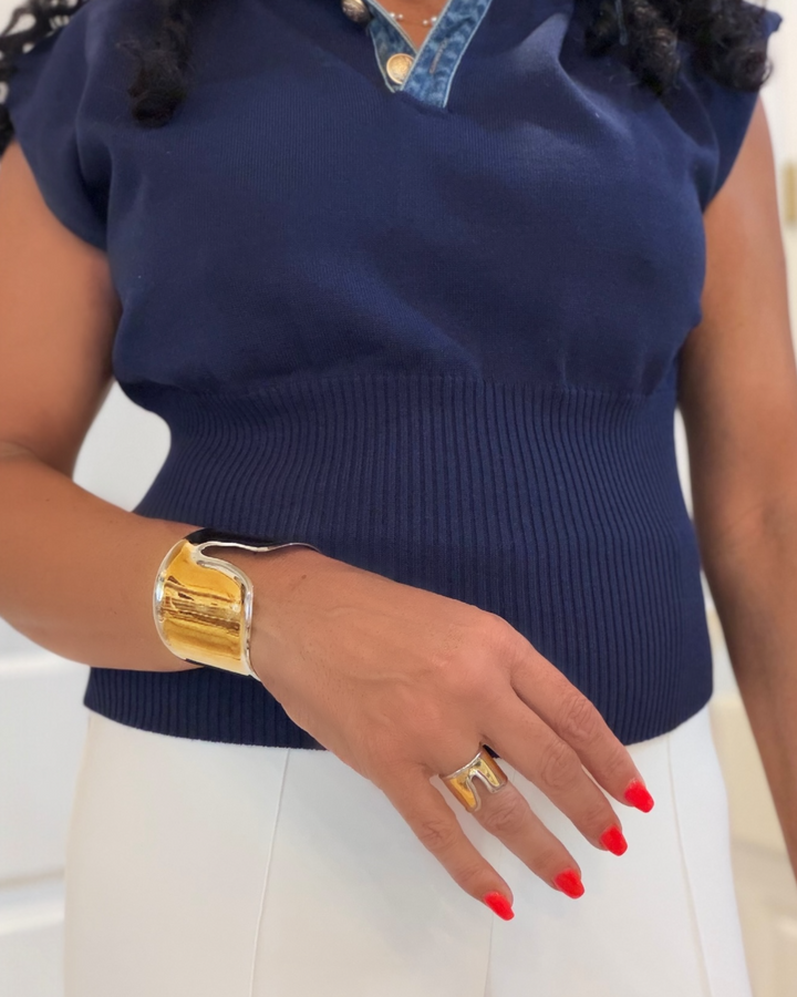 woman wearing a wide two-tone band ring