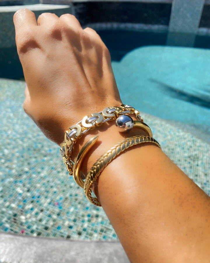 woman wearing mixed metal bracelet
