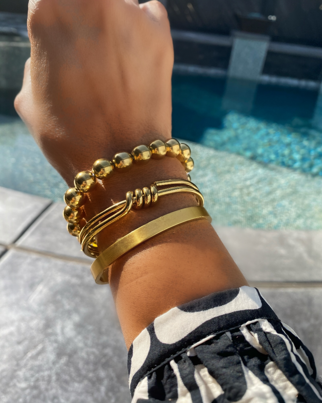 women wearing gold knot bracelet