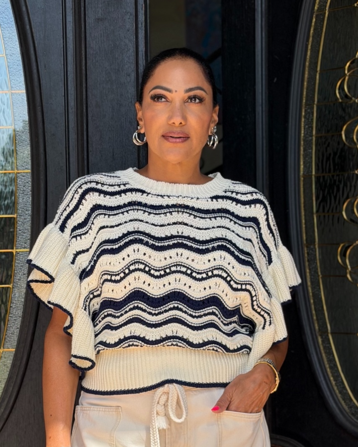 Navy and cream striped knit top with ruffle sleeves, cropped fit, and textured wave pattern