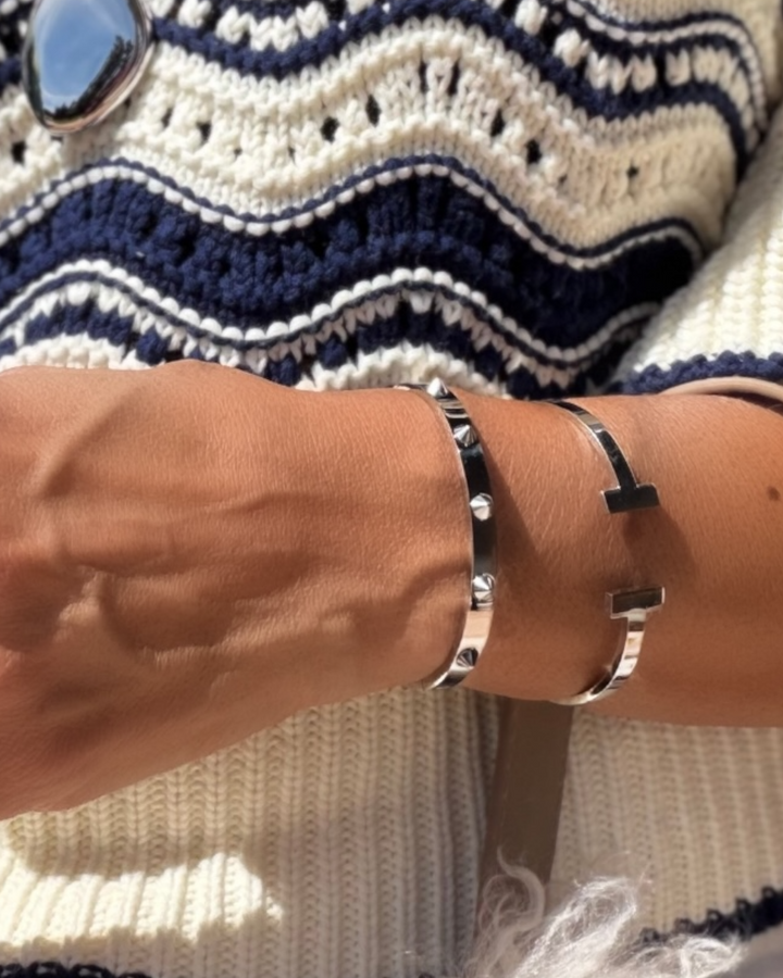 Silver studded bangle bracelet with spike details, sleek stainless steel design