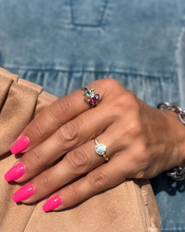 Stainless steel ring with multi-colored gemstone cluster in floral design, delicate band and vibrant finish