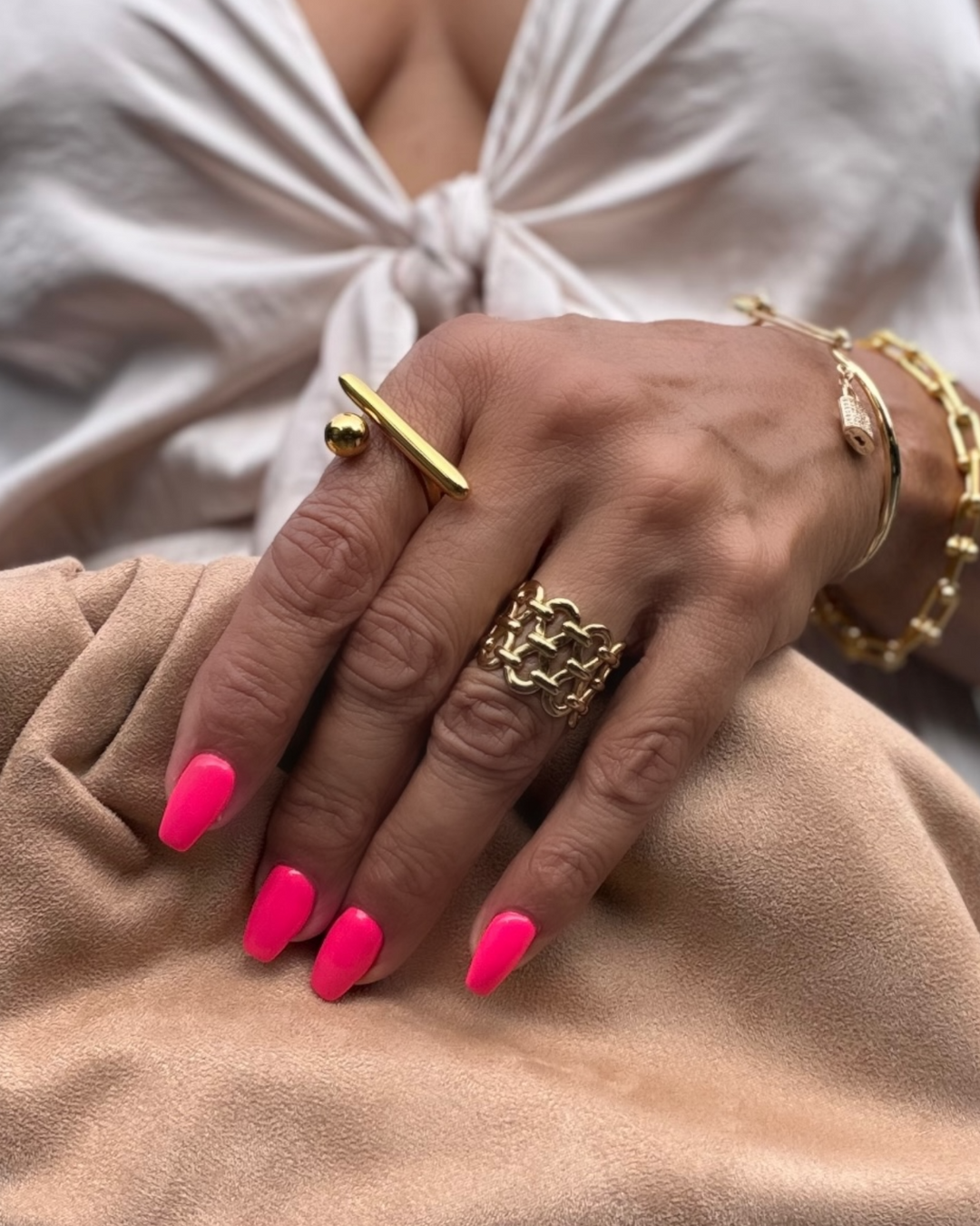 Gold woven link statement ring with wide band design and polished finish, bold and modern style