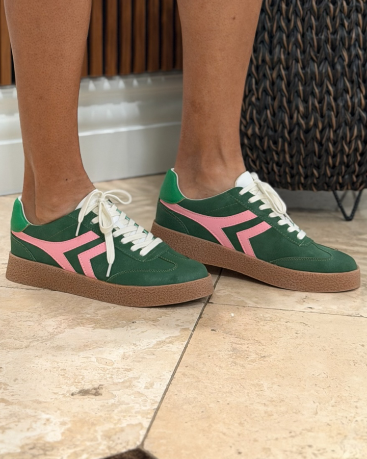 arker Sneaker worn on foot, side view showing green and pink colorway with white laces